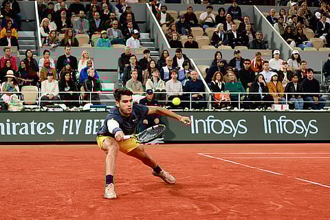 Carlos Alcaraz plays a shot against Jesper de Jong